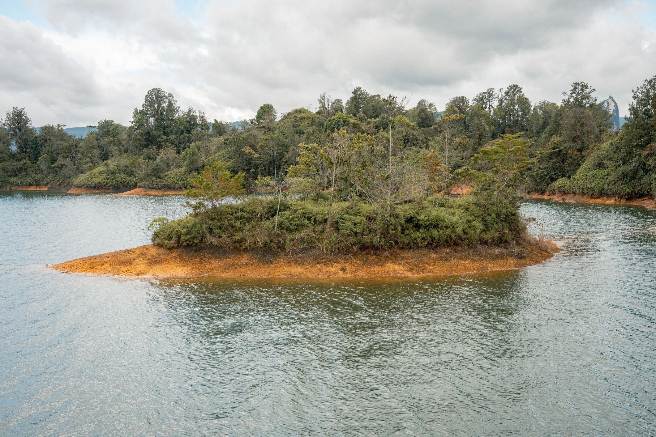 Scenic water and forest landscape representing the region